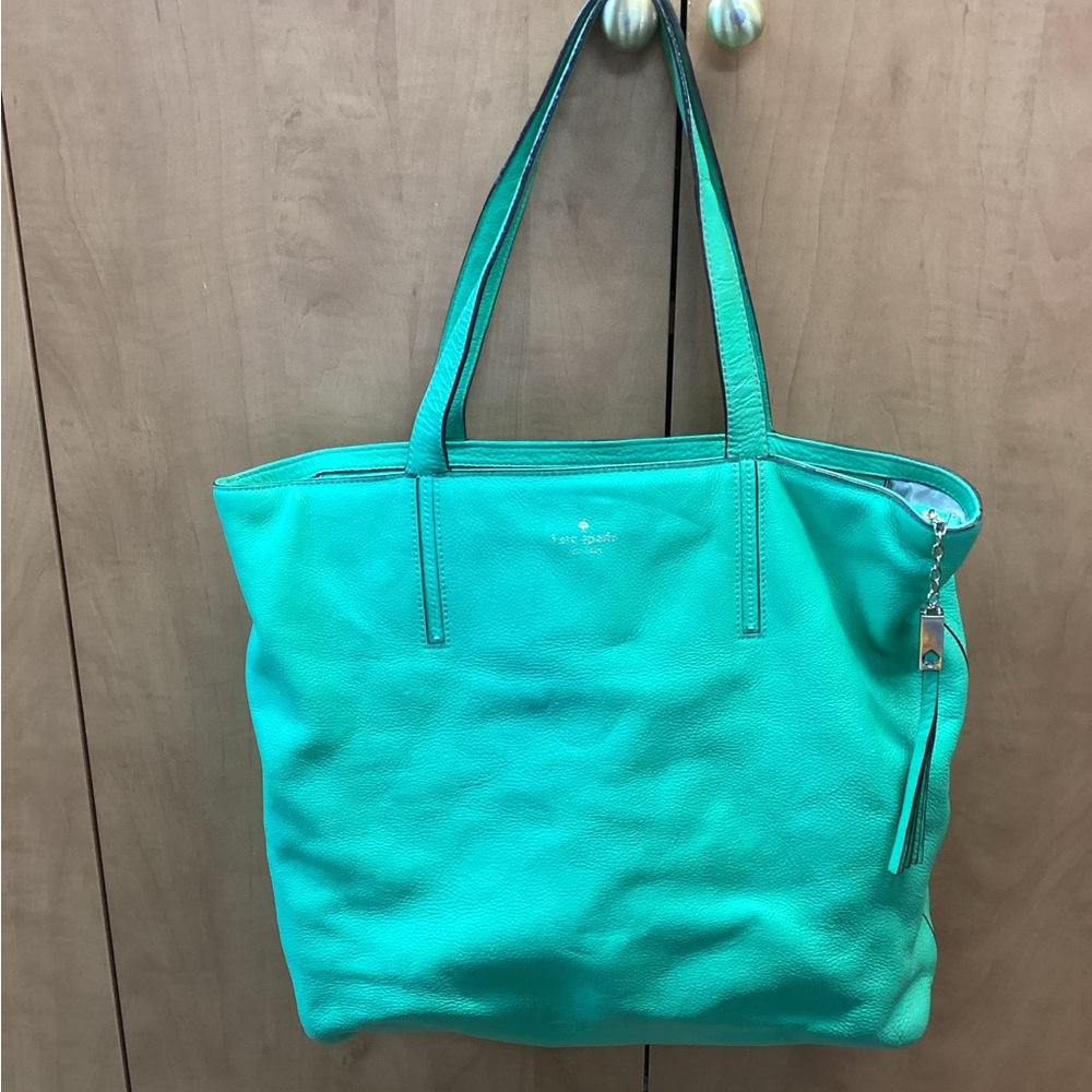 Kate Spade Pebbled Leather zip top tote in green. IS4